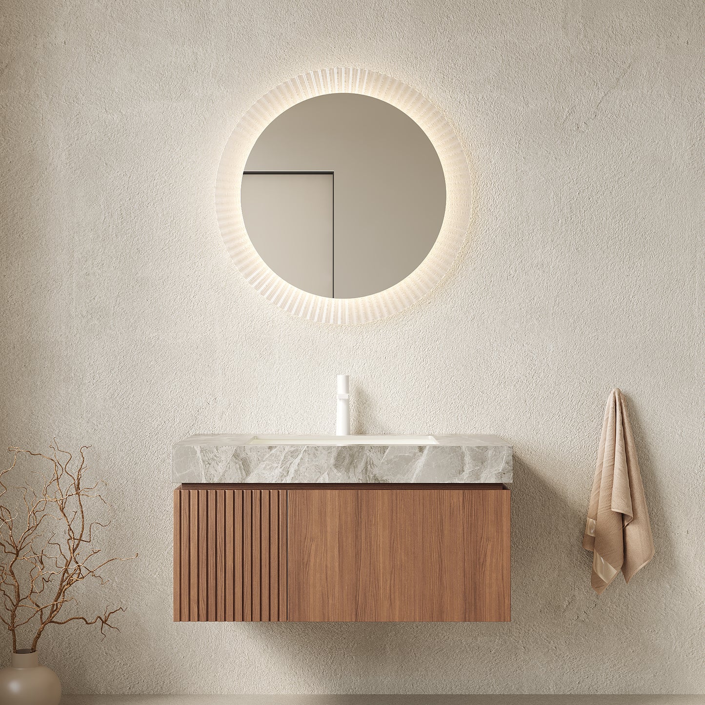 Bathroom vanity with round mirror and wooden cabinet against a beige wall.