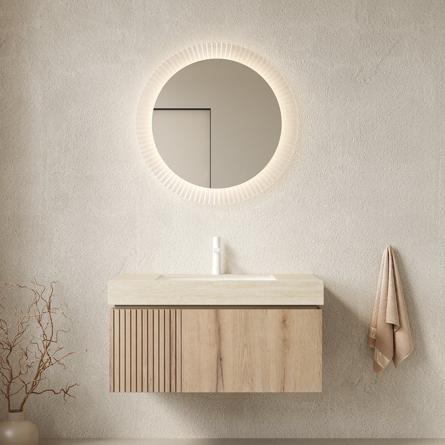 Bathroom setup with wooden vanity, round mirror, and towel on a neutral wall.