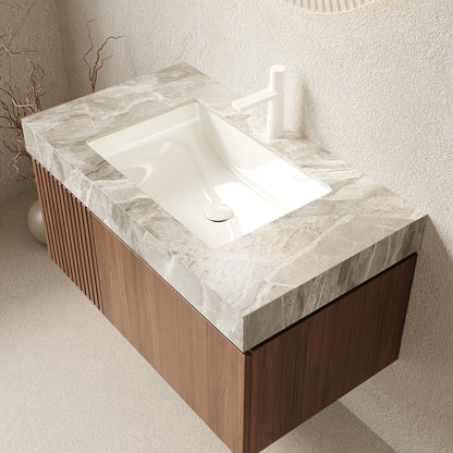 Bathroom vanity with marble countertop and wooden base