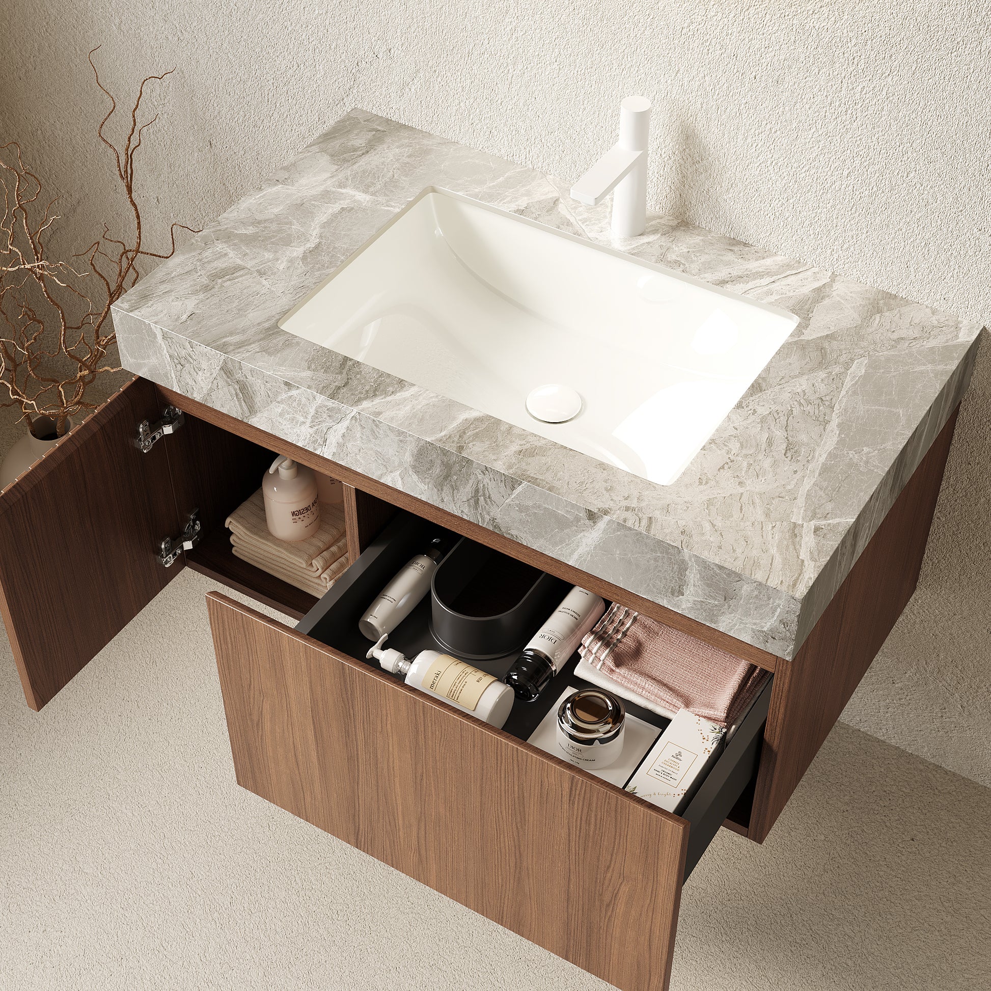 Bathroom vanity with marble countertop and open drawer showing toiletries.