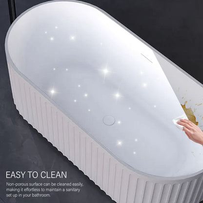 White bathtub with a hand touching the edge, highlighting ease of cleaning.